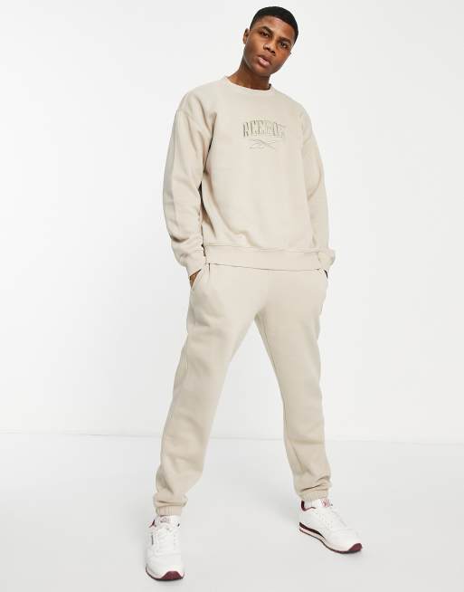 Tuta reebok strisce on sale colorate