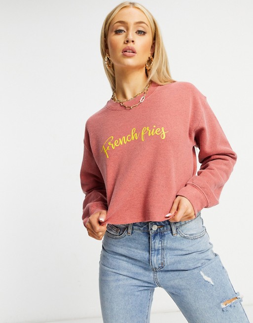 In The Style cropped slogan sweatshirt in pink