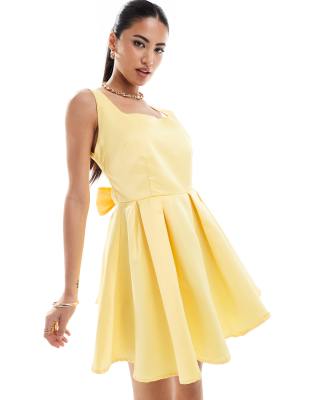 In The Style In The Style exclusive square neck bow tie back mini dress in lemon-Yellow