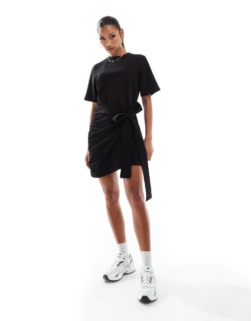 In The Style exclusive wrap tie side mini t shirt dress in black ASOS