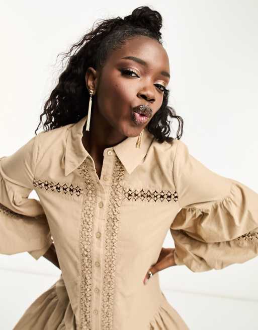 This Peplum Bell Sleeve Blouse with a ruffled hem takes Beige