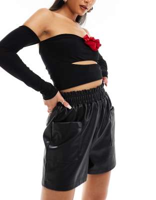 In The Style leather look stretch waist shorts in black