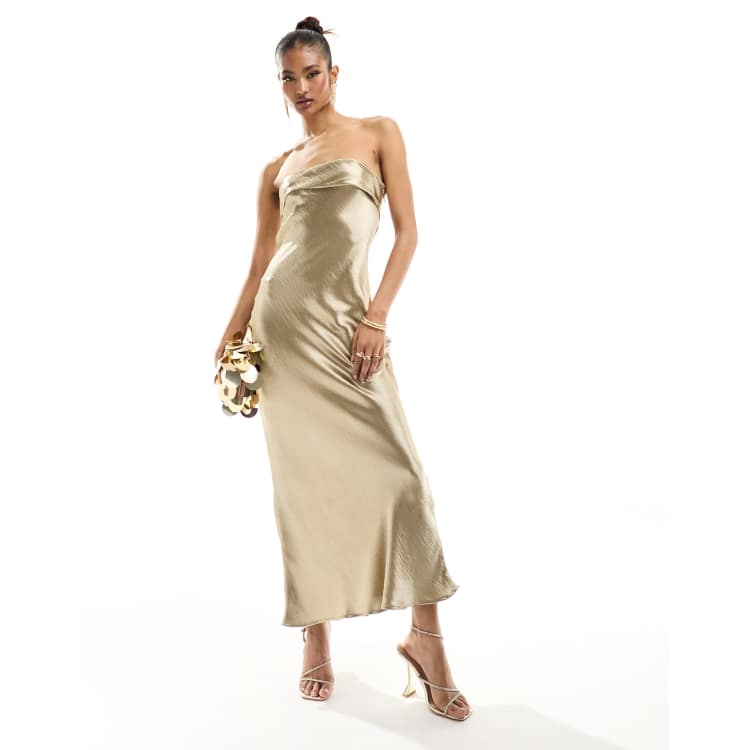 asos gold satin dress In The Style liquid satin bandeau cut out back maxi dress in gold