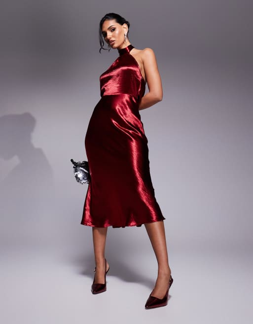 In The Style liquid satin halterneck cowl back midi dress in burgundy