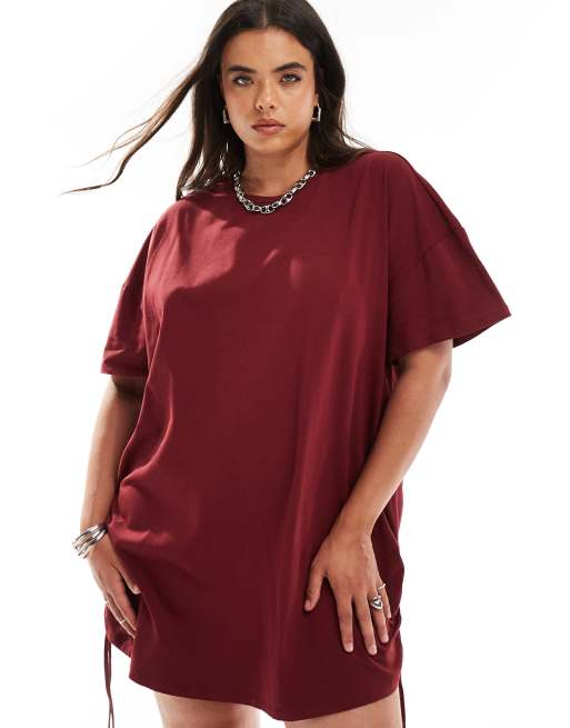 In The Style Plus exclusive ruched tie side oversized mini t shirt dress in burgundy