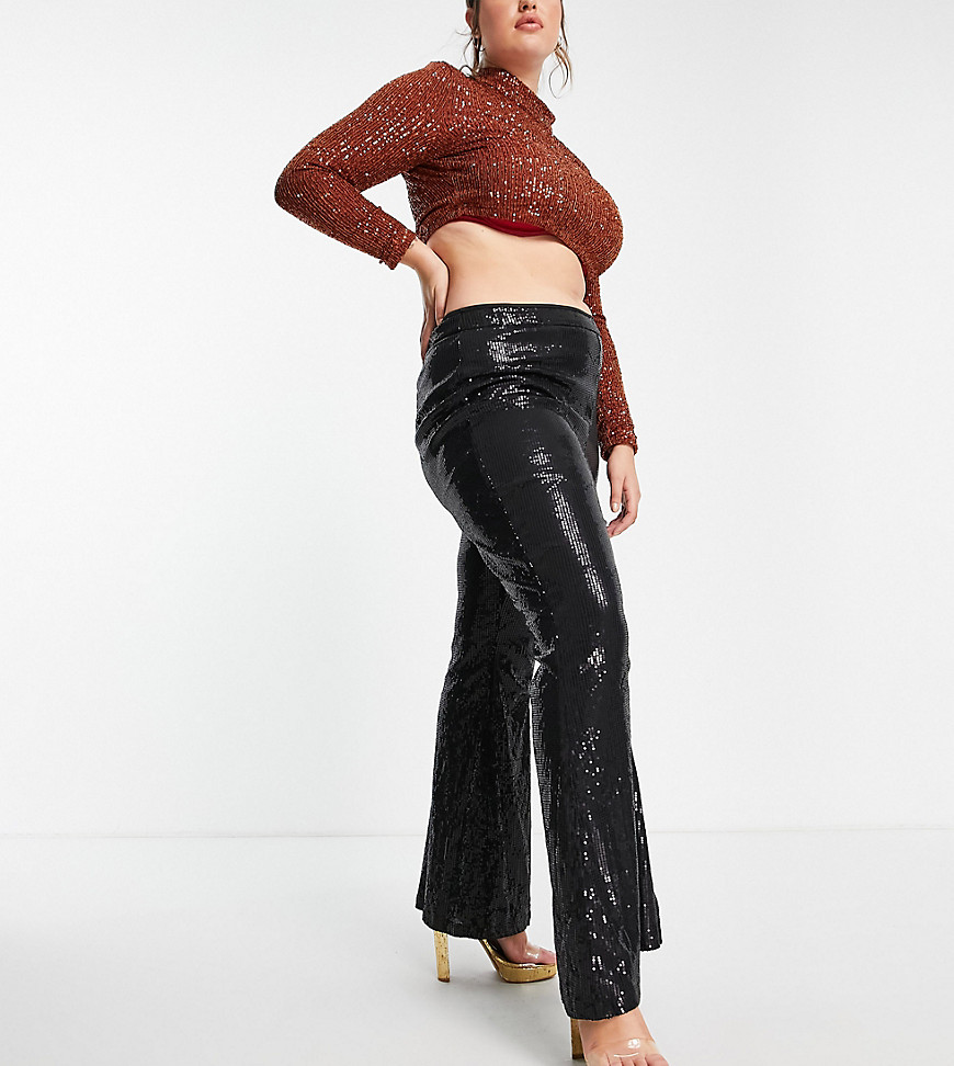 Plus-size trousers by In The Style Exclusive to ASOS Sequinned embellishment High rise Zip-side fastening Wide leg