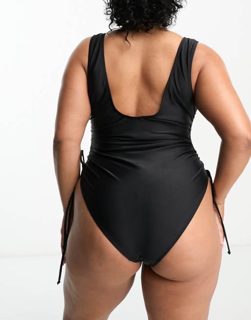 In The Style Plus ruched side scoop back swimsuit in black