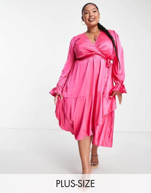 In The Style Plus satin wrap detail volume sleeve midi dress with  asymmetric ruffle hem in pink