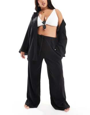 In The Style Plus x Perrie Sian textured wide leg beach pants with drawstring in black