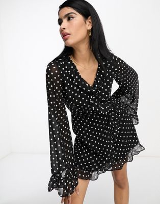 In The Style x Georgia Louise volume sleeve ruffle detail mini dress in black polka dot