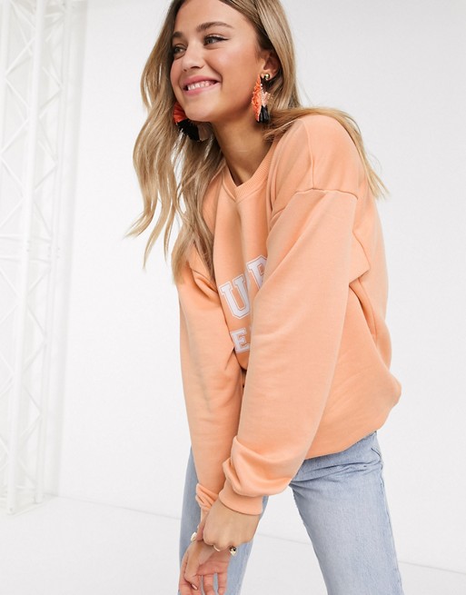 In The Style x Meggan Grubb motif oversized sweat top in coral