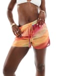 [In The Style] In The Style x Perrie Sian exclusive semi sheer beach shorts in orange ombre 6 Orange print