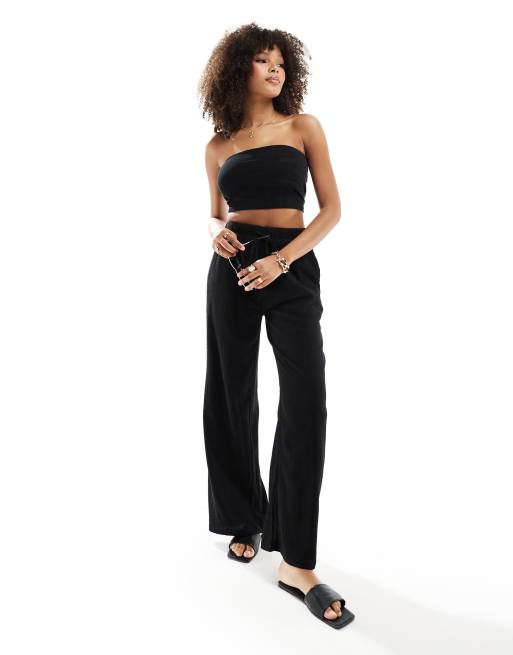 In The Style x Perrie Sian - Exclusivité - Pantalon ample de plage noué à la taille en tissu texturé - Noir