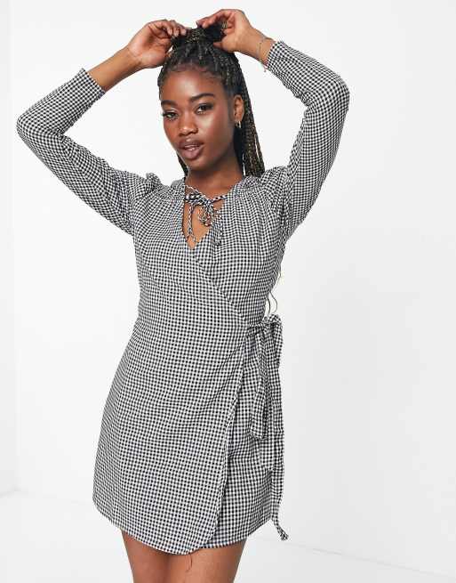 In The Style x Perrie Sian puff shoulder detail asymmetric tie side mini dress in gingham print