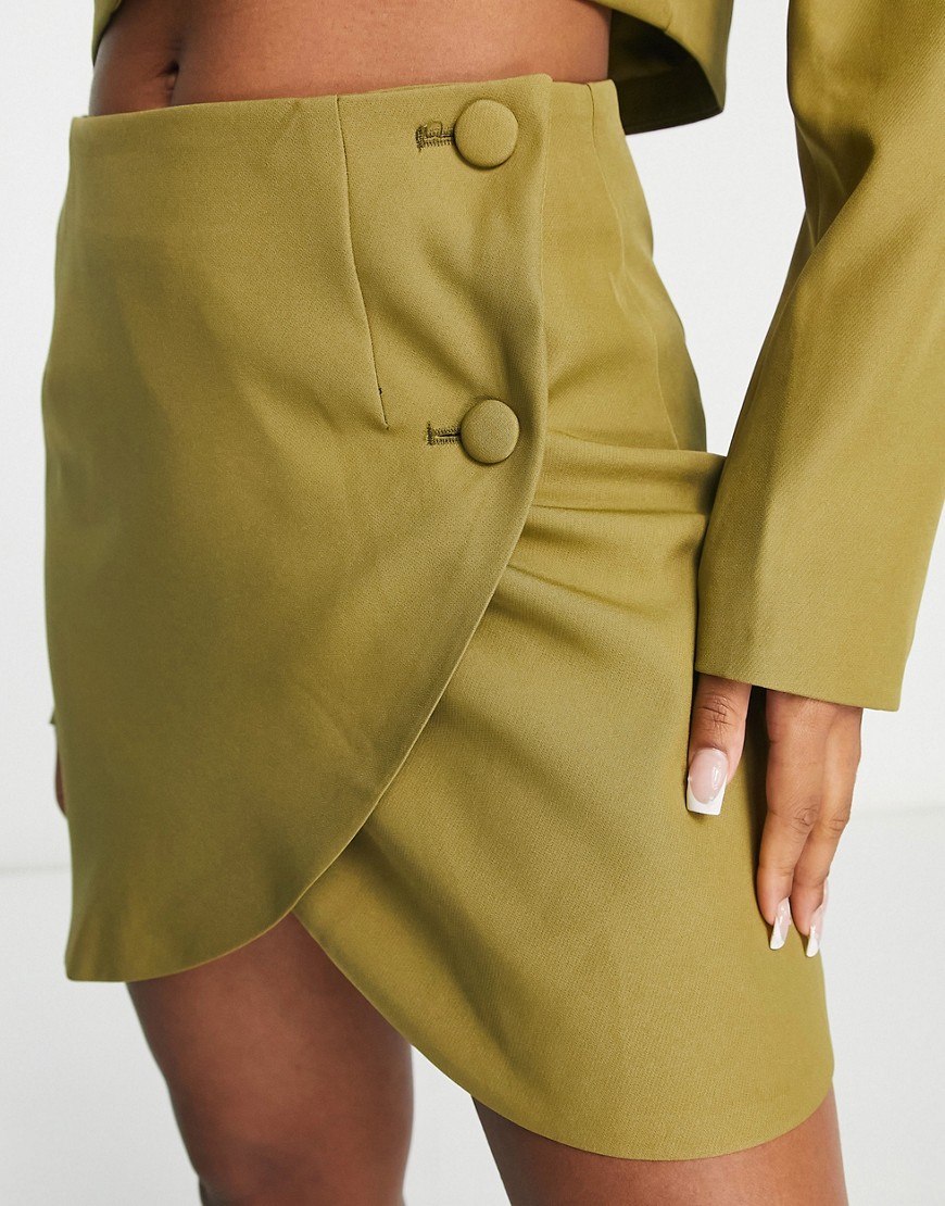 In The Style x Perrie Sian wrap detail mini skirt co-ord in khaki-Green