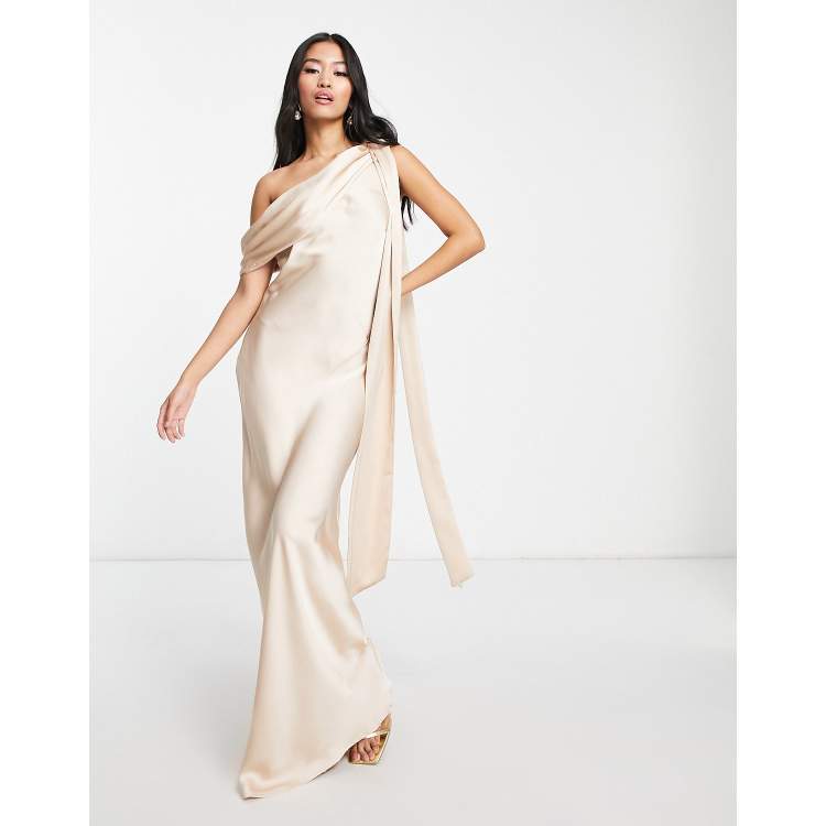 In The Style x Terrie Mcevoy draped neckline asymmetric maxi dress in light gold ASOS