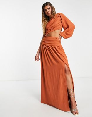In The Style x Yasmin Devonport exclusive pleated one volume sleeve cut out waist maxi dress in tan