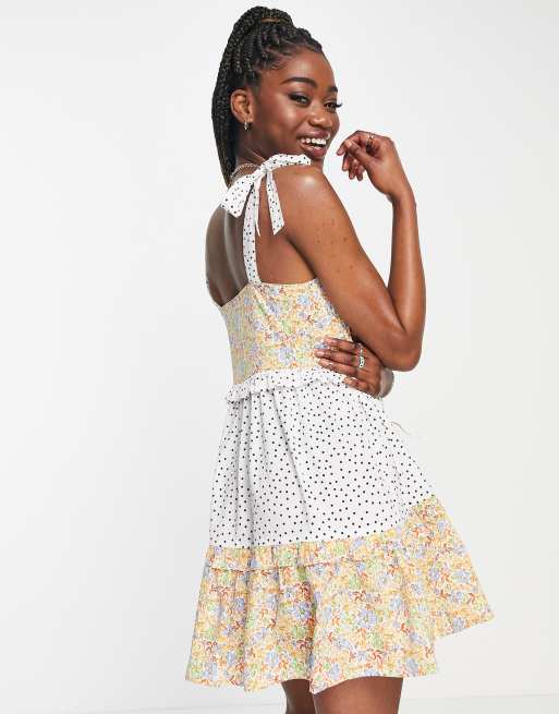 Influence bow tie strap cami mini dress in mixed floral ASOS