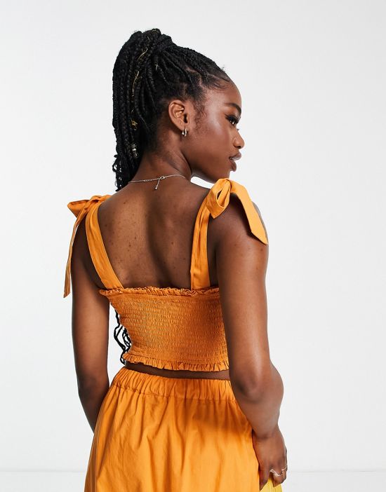 https://images.asos-media.com/products/influence-tie-shoulder-shirred-crop-top-in-rust-part-of-a-set/202377409-2?$n_550w$&wid=550&fit=constrain