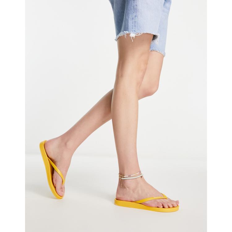 Ipanema anatomic flip flops in yellow ASOS