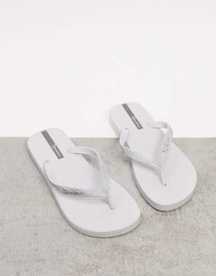 white sparkly flip flops