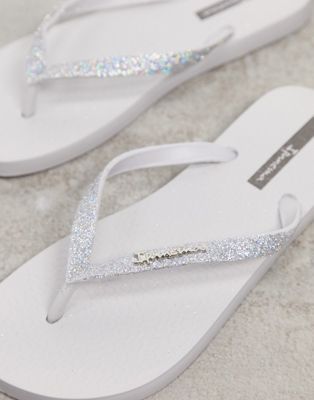 white sparkly flip flops