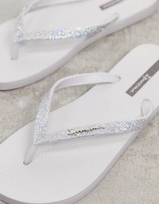 white sparkly flip flops