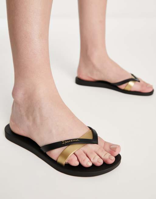 Black and gold store flip flops womens