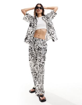 IIsla & bird graphic print loose fit beach trouser co-ord in white and black