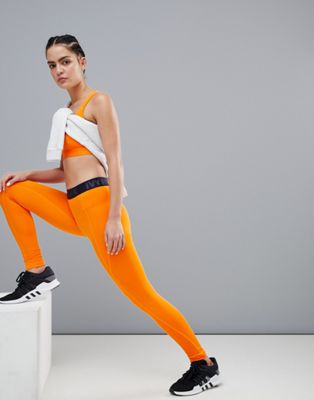 Ivy Park - Sportlegging met logo op de tailleband en stiksels in oranje