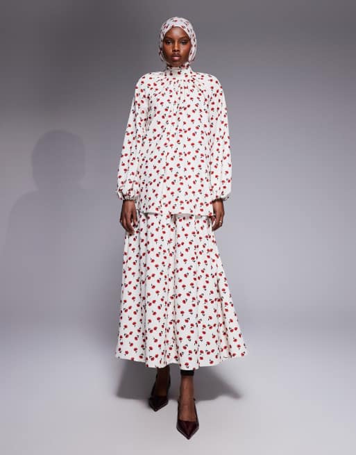 IYAL - Coordinato con top accollato con maniche svasate e gonna lunga color crema con stampa di rose