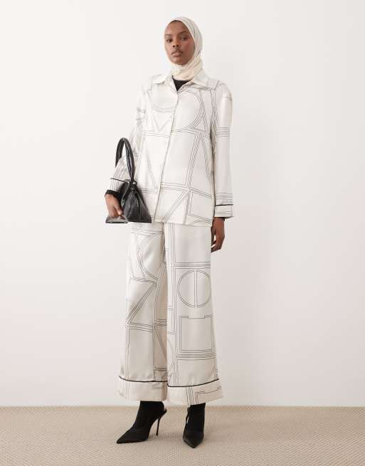 IYAL - Pantaloni del pigiama color crema con stampa geometrica e profili a contrasto in coordinato