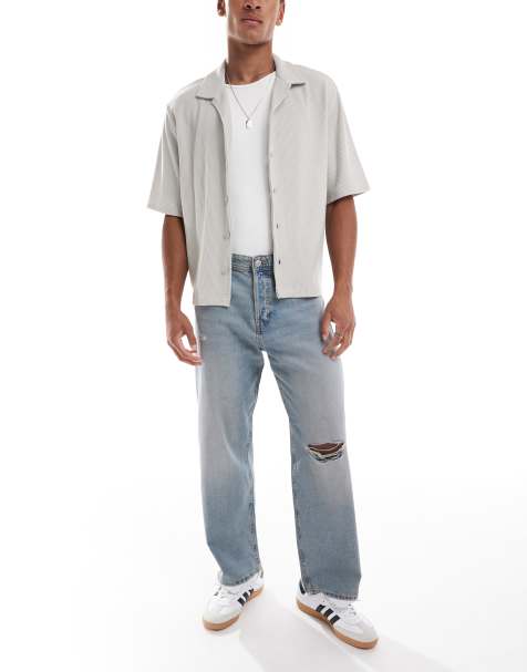 Jack & Jones Alex baggy jeans with knee rip in stonewashed blue - view 1