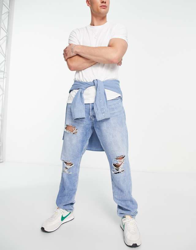 Jack & Jones chris loose fit jean with knee rips in mid blue