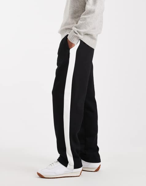 Jack & Jones loose fit sweat pants in black with side stripe