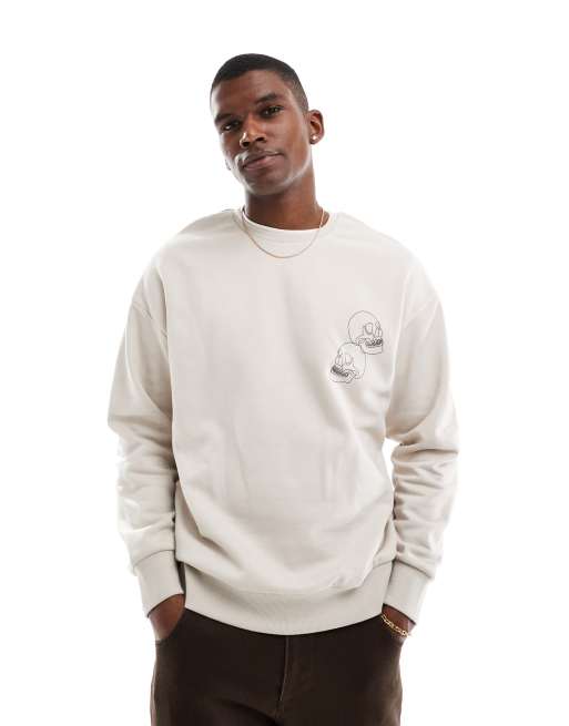Jack Jones drop shoulder crew neck sweatshirt with skull back print in beige