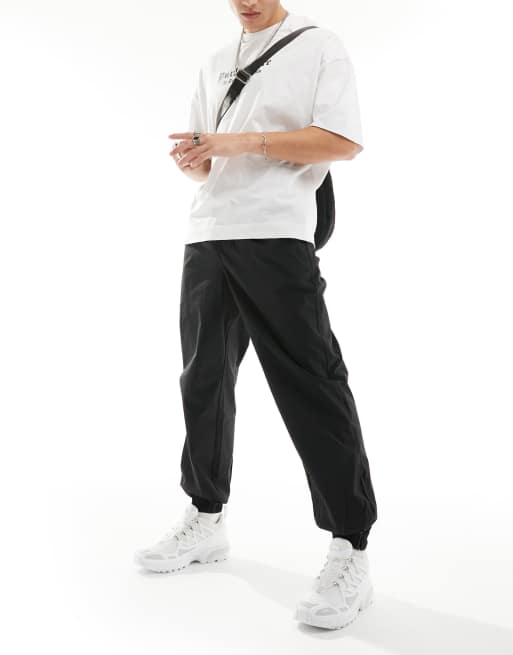 Jack & Jones – Funktions-Jogginghose in Schwarz mit Bündchen 