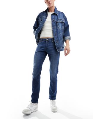 Glenn - Schmal geschnittene Jeans in mittelblauer Waschung Blau W34 L32