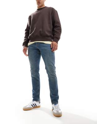 Glenn - Schmal geschnittene Jeans in verwaschenem Mittelblau Blau W31 L34