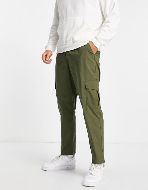 ASOS DESIGN relaxed cargo pants in dark green cord