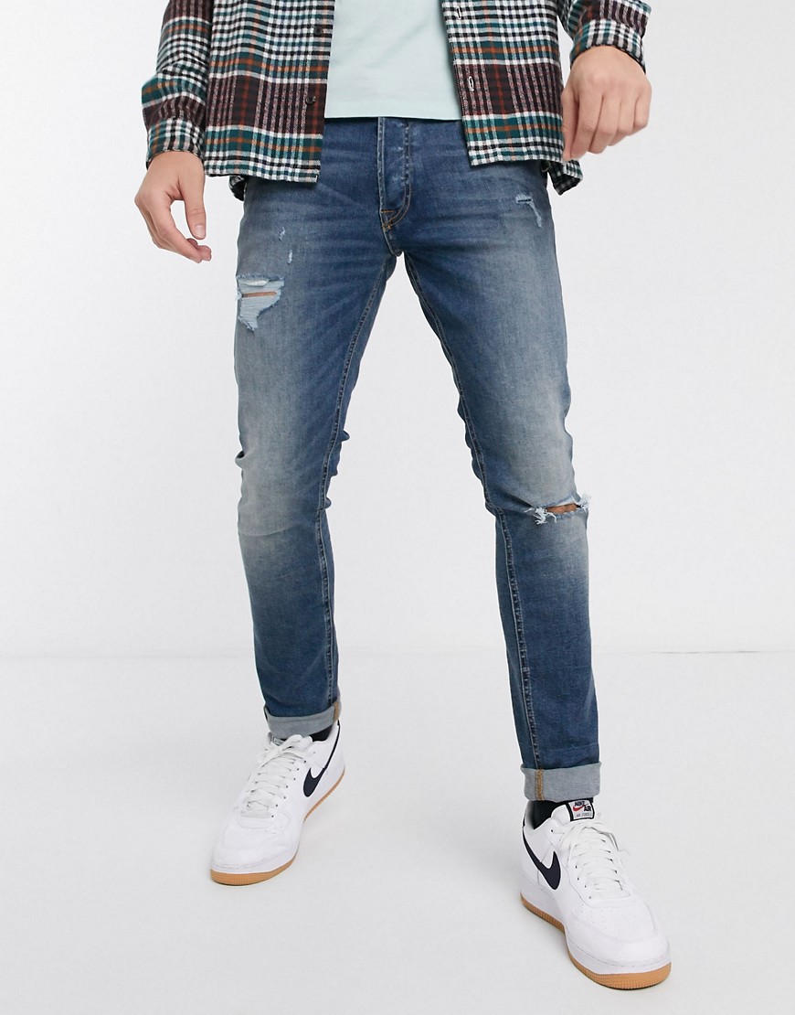 Jack & Jones Intelligence - Elastische slim-fit jeans met scheuren in blauw