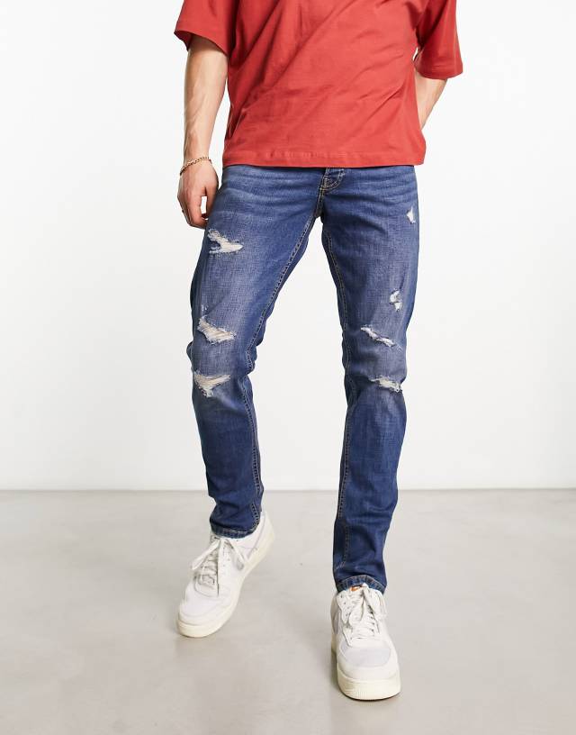 Jack & Jones Intelligence glenn slim fit jean in mid blue wash with abrasions