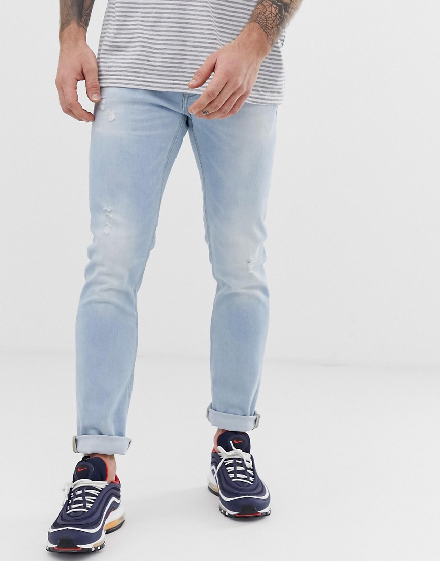 Jack & Jones Intelligence - Jeans slim lavaggio chiaro con abrasioni-Blu