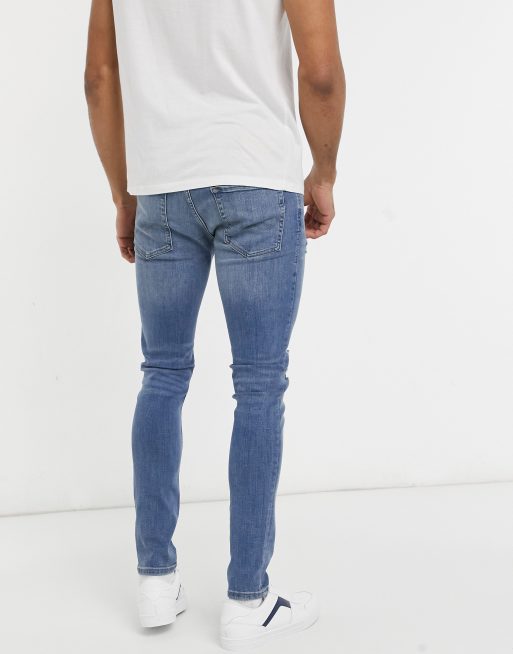 Jack & Jones Intelligence – Liam – Enge Jeans mit Zierrissen in Blau, 2 von 4