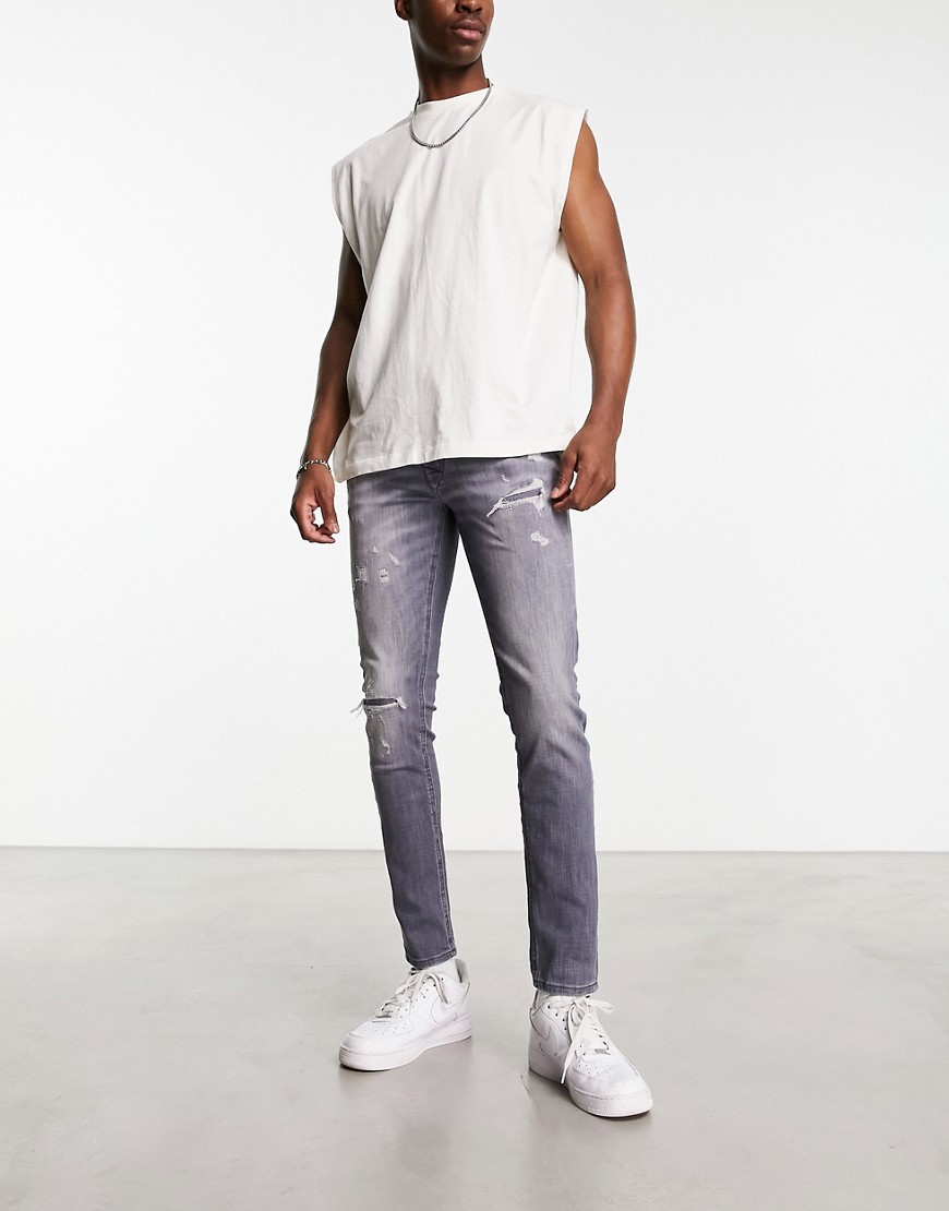 Jack & Jones Intelligence Liam super stretch skinny fit jeans with rip and repair in grey wash