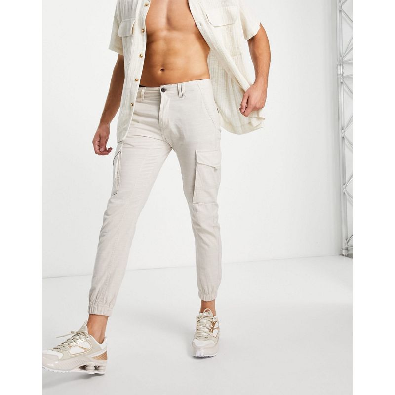 Uomo Pantaloni cargo Jack & Jones Intelligence - Pantaloni cargo con elastici sul fondo in lino bianco sporco 