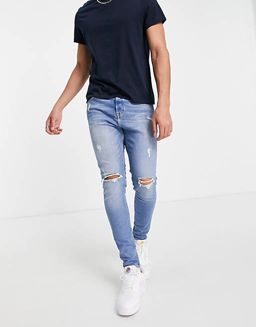 Jack & Jones Intelligence Pete carrot fit jeans with rips in midwash blue
