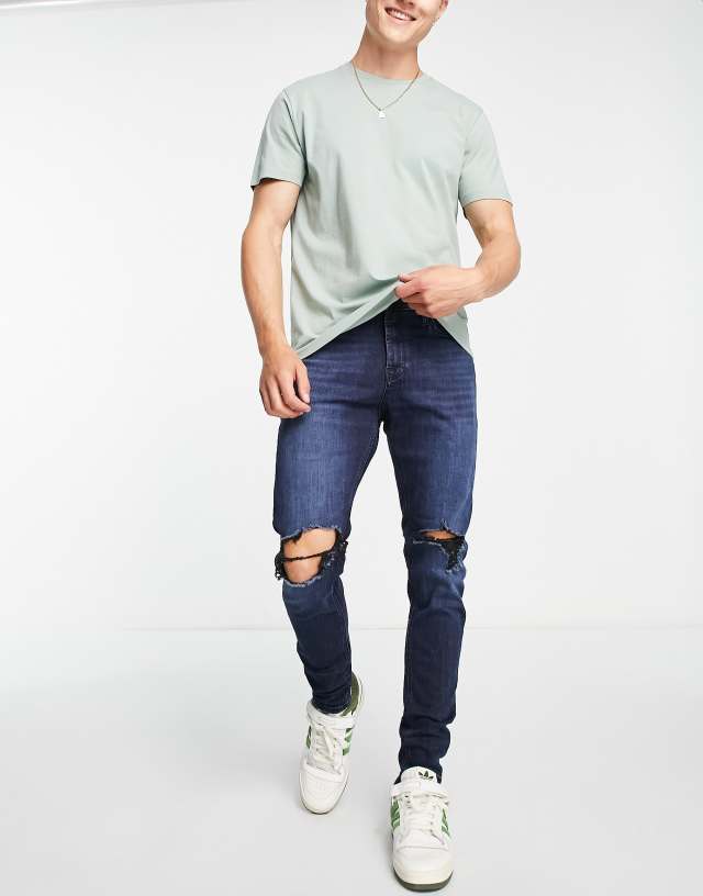 Jack & Jones - intelligence pete skinny carrot jean with knee rips in blue black wash