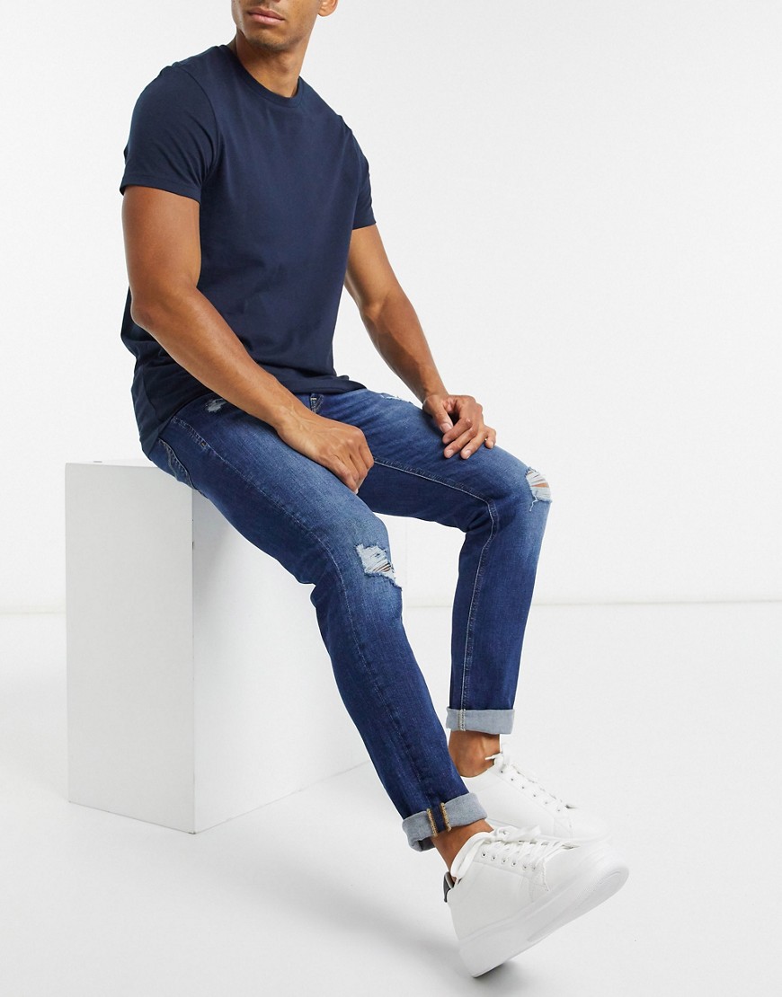 Jack & Jones - Intelligence - Slim-fit jeans met scheuren in middenblauw