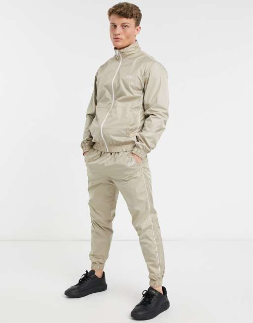 Jack & Jones Intelligence tracksuit with piping in beige | ASOS